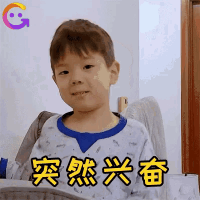 a young boy wearing a blue shirt with chinese writing on it