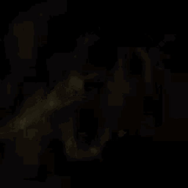 a blurry picture of a man in a suit and tie in the dark
