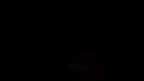 a black background with red and yellow flames coming out of the bottom