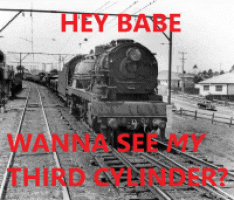 a black and white photo of a train with the caption " hey babe wanna see my third cylinder "