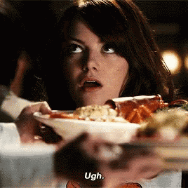 a woman is holding a bowl of food and says ugh