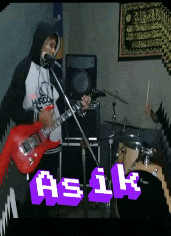 a man playing a guitar and singing into a microphone with the words asik in purple letters