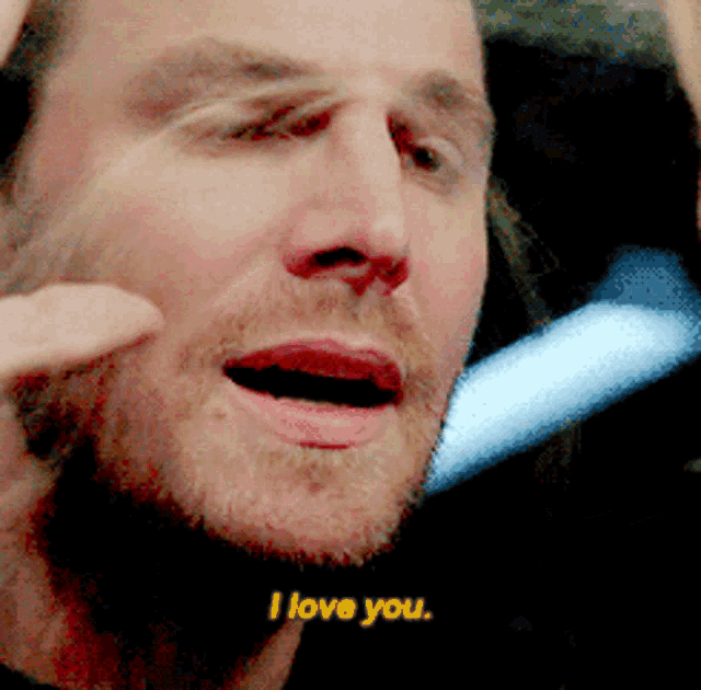 a close up of a man 's face with the words " i love you " visible