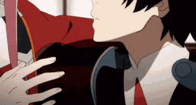 a close up of a person touching another person 's face .