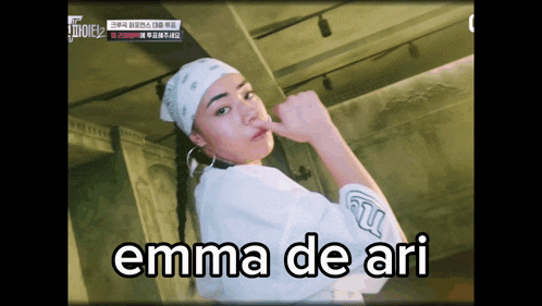 a woman with a bandana on her head and the word emma de ari on the bottom right