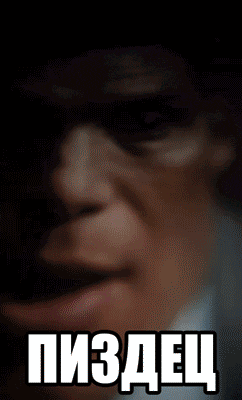 a close up of a man 's face with a foreign language written on it