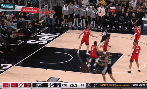 a basketball game is being played in front of a crowd and the score is 95 to 33