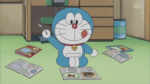 a cartoon of doraemon sitting on the floor reading a book