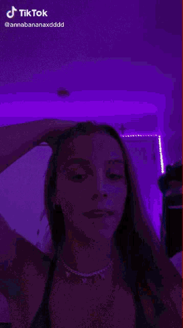 a woman 's face is blurred in a tiktok video