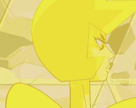 a close up of a yellow diamond from steven universe making a face .