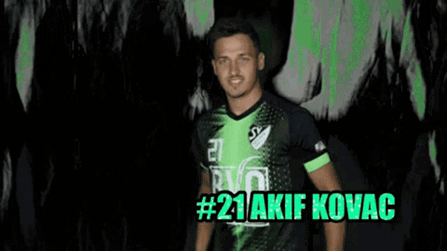 a man in a green and black jersey with # 21 akif kovac written on the bottom