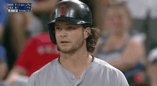 a baseball player wearing a black helmet with the letter b on it .