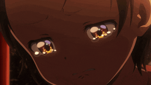 a close up of a person 's eyes with tears running down them