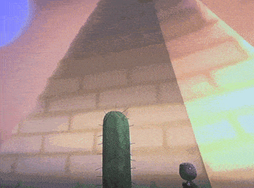 a cactus stands in front of a pyramid