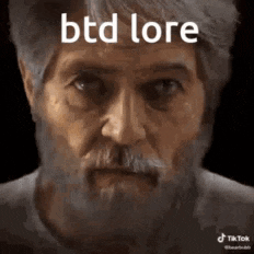 a man with a beard and mustache is looking at the camera with the words `` btd lore '' written on his face .