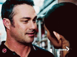 a man and a woman are looking into each other 's eyes with a global logo in the background