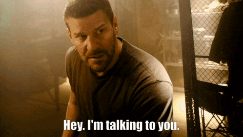 a man says hey i 'm talking to you in a dark room