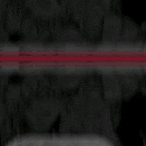 a yellow sign with the letter h on it is on a dark background