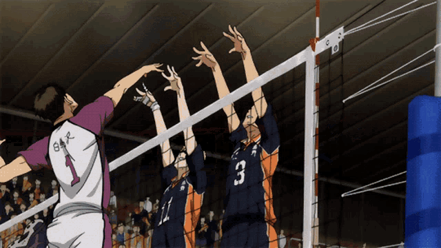 a volleyball player with the number 3 on his jersey is jumping over the net