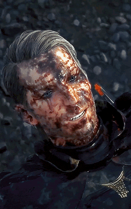 a man with blood on his face is smiling with a knife in his hand