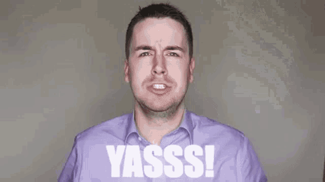 a man in a purple shirt is making a funny face with the word yasss written in white