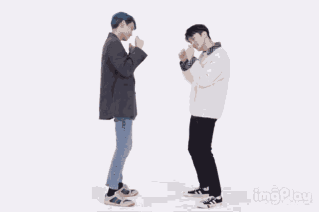 two young men are dancing in front of a white background with imgplay written in the corner