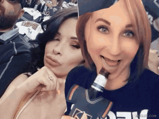 two women are posing for a picture with one wearing a jersey that says ' new york '