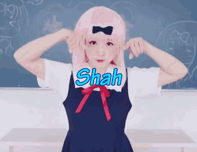 a girl with pink hair and the word shah written on it