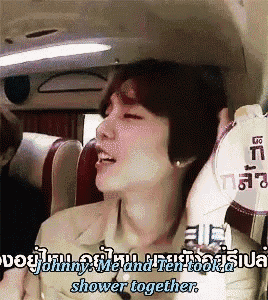 a man is sitting in a car with the words johnny me and ten took a shower together