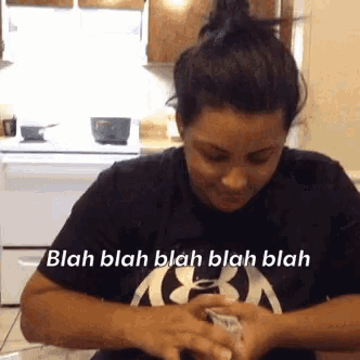 a woman wearing a black shirt that says blah blah blah