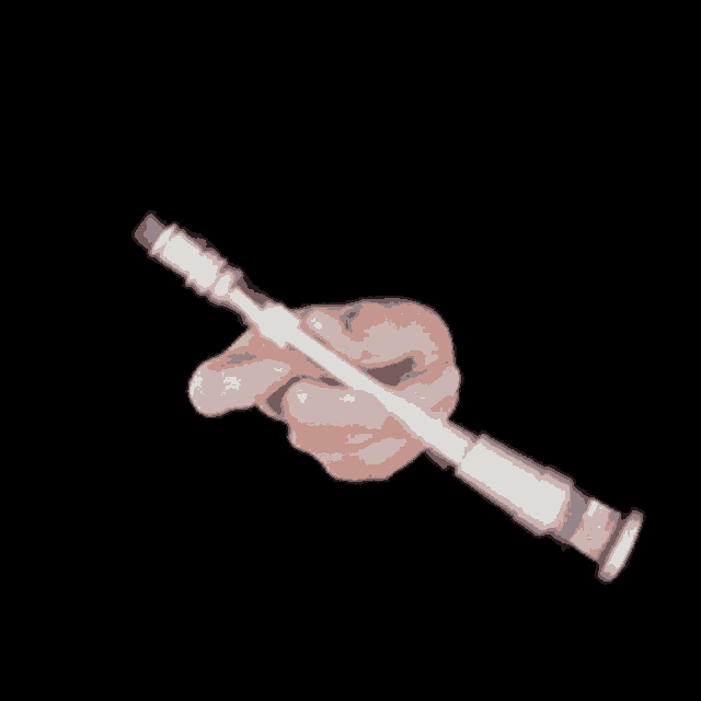 a person 's hand is holding a metal object in their right hand against a black background .