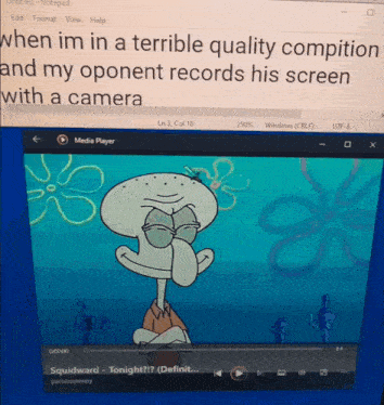 squidward from spongebob squarepants is playing a video on a computer screen