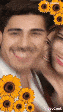 a man and a woman are posing for a picture with sunflowers on their faces