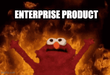 elmo is standing in front of a fire with the words enterprise product written below him