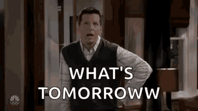 a man is standing in a living room with his hands on his hips and says what 's tomorrow .
