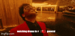 a man in a red suit and sunglasses is watching a drama in general