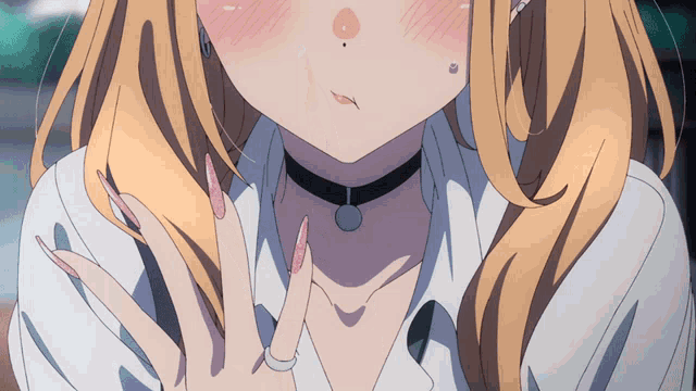 a close up of a girl 's face with a ring on her finger