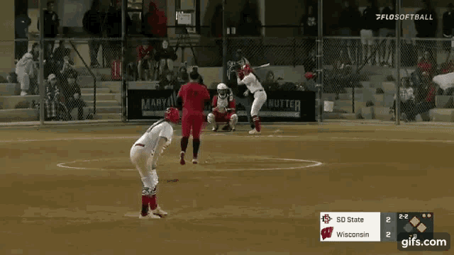 a softball game between so state and wisconsin is underway