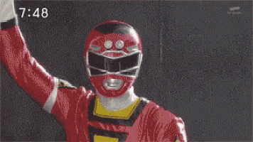 a group of power rangers are standing in a room with the time 7:48 on the bottom