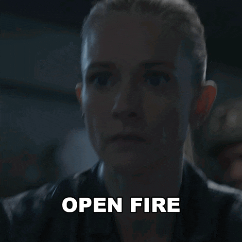 a close up of a woman 's face with the words open fire written above her