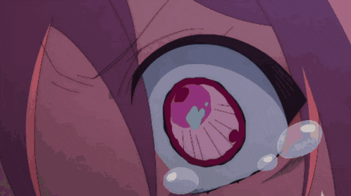 a close up of a cartoon character 's eye with bubbles coming out of it