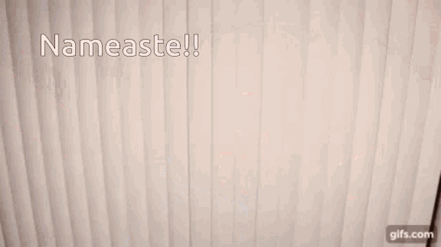 a man in a blue shirt is flexing his muscles with the words nameaste written above him