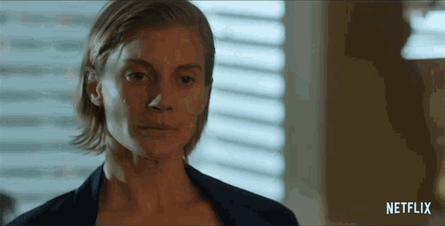 a close up of a woman 's face with the word netflix on the bottom