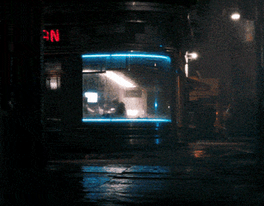 a neon sign that says " an " is lit up at night