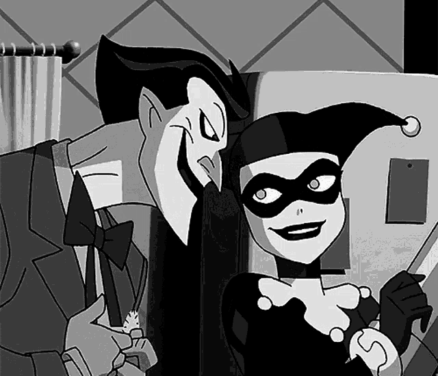 harley quinn and the joker pose for a picture