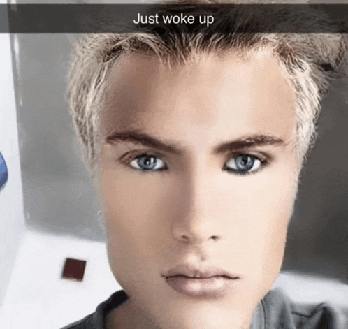 a close up of a man 's face with the words just woke up above it