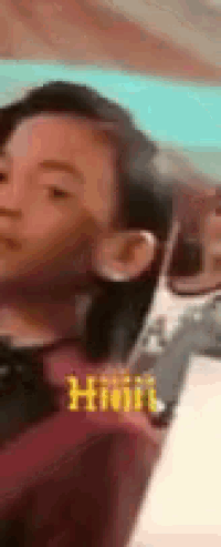 a close up of a person 's face with a blurred background and the word hhh on the bottom .