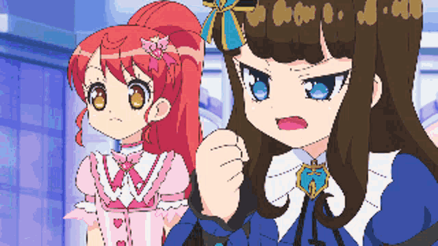 a pixel art drawing of a girl with red hair and a girl with brown hair and blue eyes