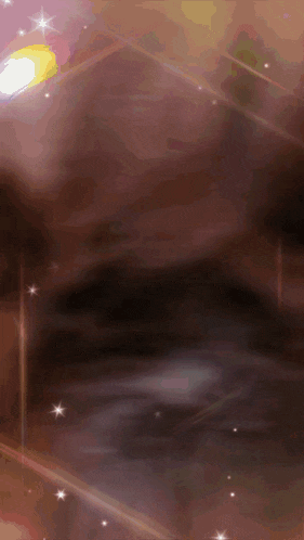 a blurred image of a person 's face with a light shining on it