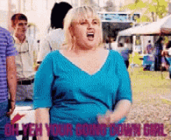 a woman in a blue shirt with the words oh yeah your going down girl written below her